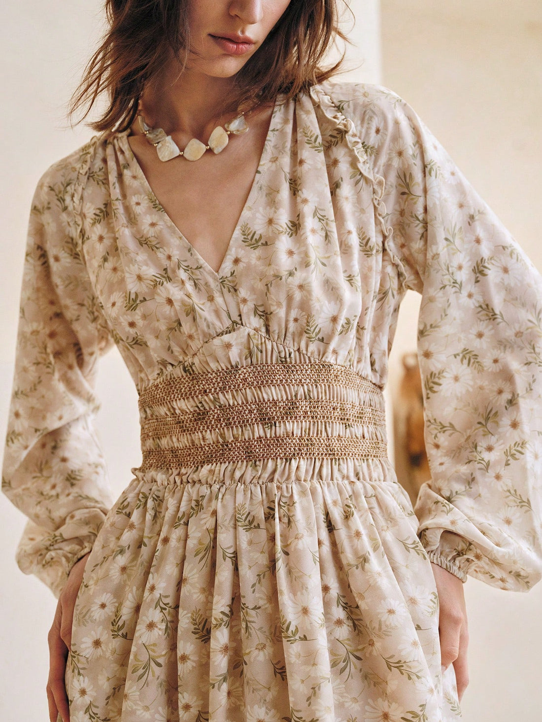 Step into summer with this playful ditsy floral dress, featuring charming ruffles and long sleeves for a breezy yet covered look. Its flattering A-line silhouette moves with you, making it perfect for sunny days and spontaneous adventures. Effortless style meets comfort in this must-have dress that brightens any occasion.