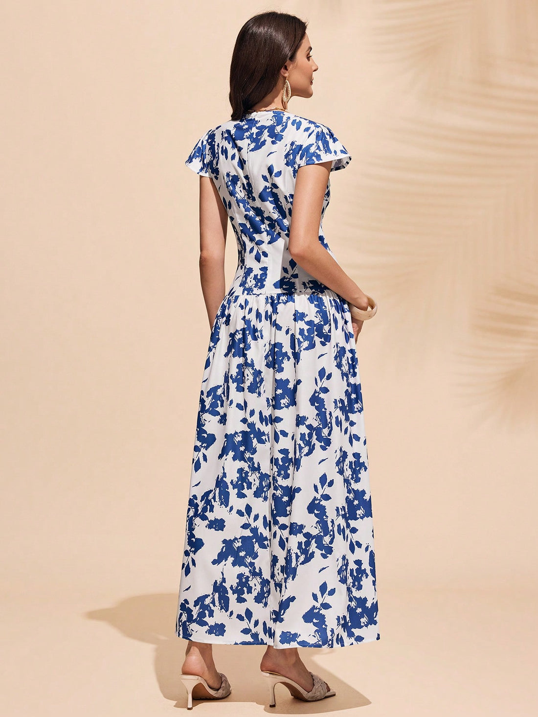 Get ready to make a statement with our Elegant Floral Print Long Dress! The fresh blue and white design adds a touch of elegance to any occasion. With a flattering fit and flowy silhouette, this dress is perfect for making a playful yet chic statement.