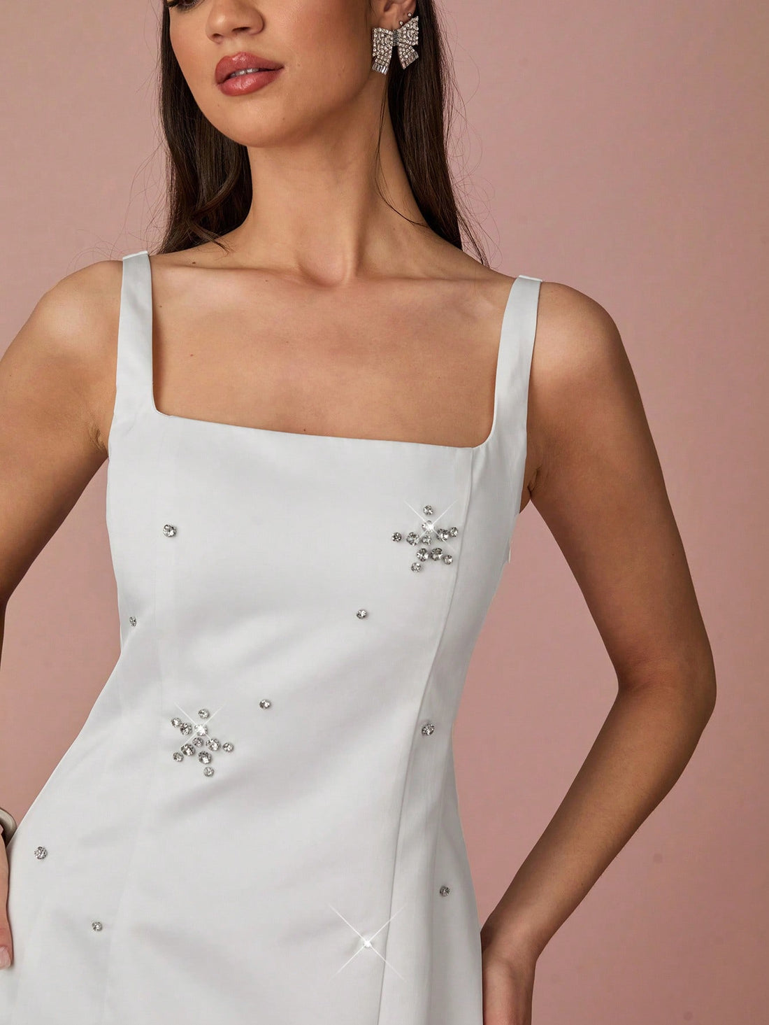 Say goodbye to boring dresses and hello to this Charming White Rhinestone Mini Dress! Perfect for summer vacations and special events, this dress features stunning floral decor and will make you stand out in any crowd. So why blend in when you can be charmingly unique?