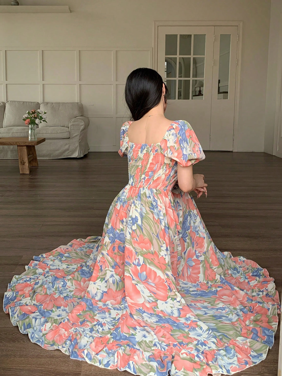 Twirl into style with our Chic Shirred Floral Midi Dress! This flirty number hugs your waist in all the right places while the playful floral pattern dances with every step. Short sleeves keep you cool, and the midi length strikes that perfect balance between fun and sophisticated. Your go-to dress for turning heads and collecting compliments!