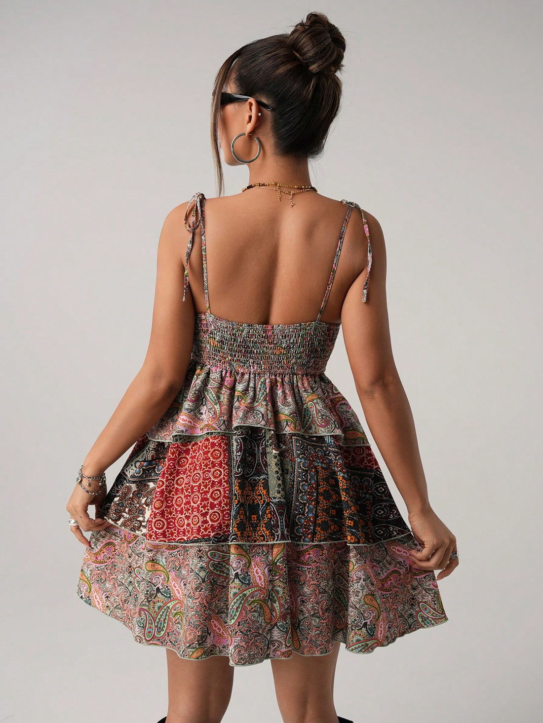 Twirl into vacation mode with this flirty floral mini dress! The playful ruffle hem adds a bounce to your step, while the sleeveless design keeps you cool during sunny adventures. Perfect for beach strolls, dinner dates, or impromptu photo ops – just slip it on and let the compliments roll in. No fuss, all fun!