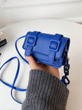 Lifestyle view of mini crossbody bag paired with weekend outfit