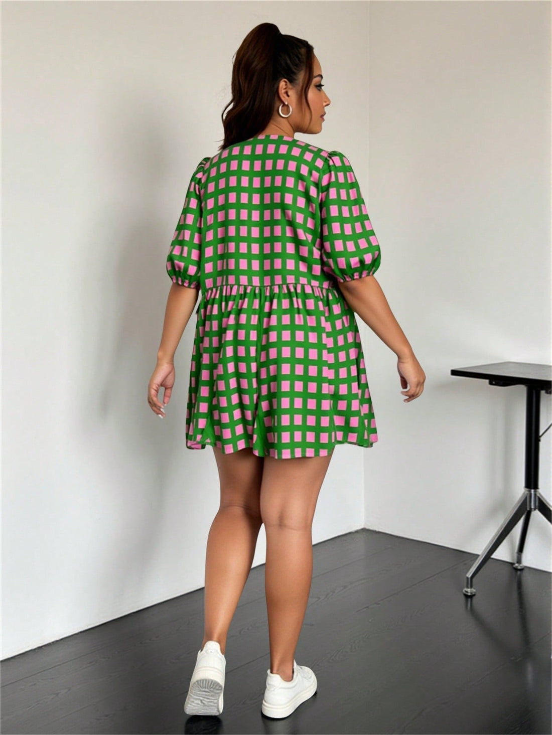 Step out in style with this chic plus size casual dress featuring a bold geometric print that adds a fun twist to your wardrobe. The front tie detail flatters your silhouette, while the lantern sleeves bring a playful, breezy vibe perfect for any occasion. Comfortable and eye-catching, this dress is your go-to for effortless charm and confidence.