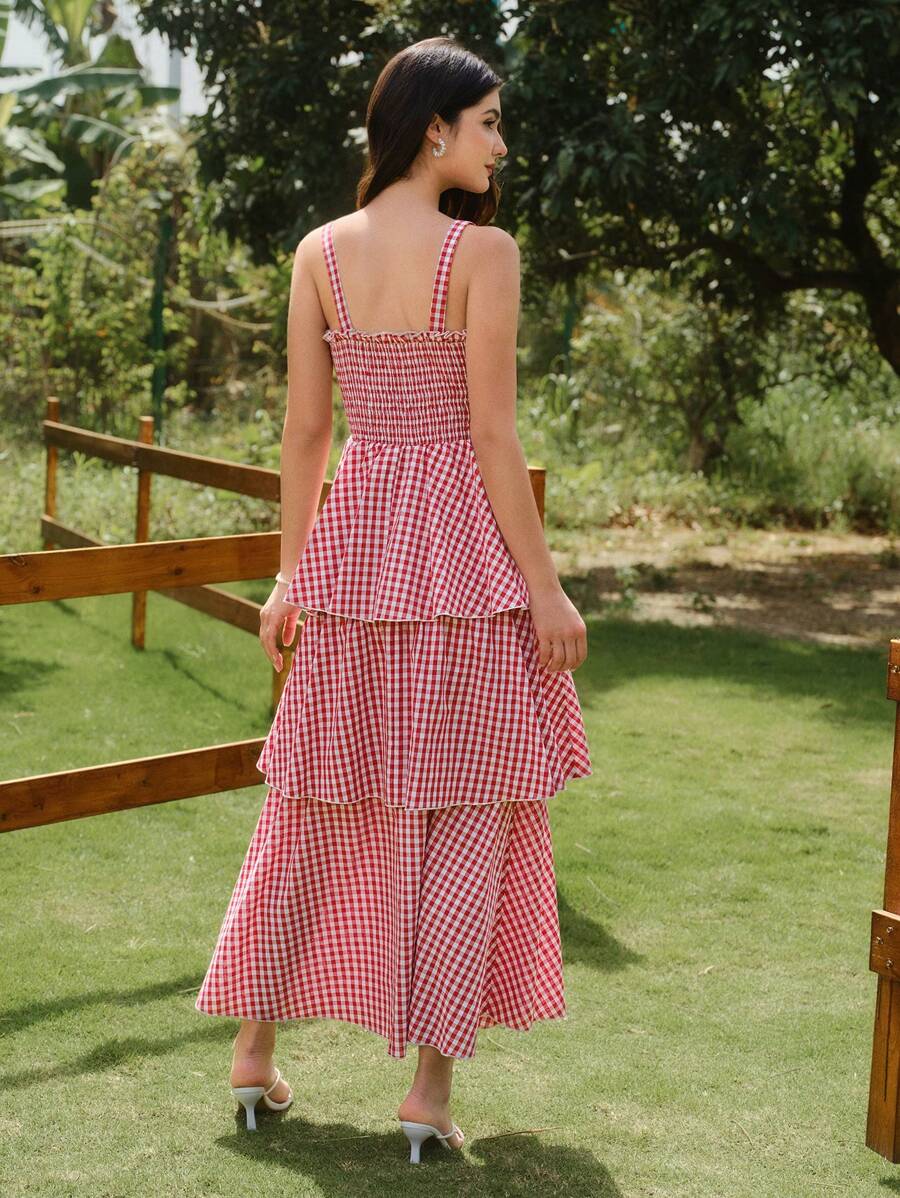Get ready to turn heads in this Chic Plaid Summer Dress! The elegant red and white design features a fitted strap cake dress that will flatter your figure. Perfect for any summer occasion, this dress will make you feel confident and stylish. Don't miss out on this must-have addition to your wardrobe!