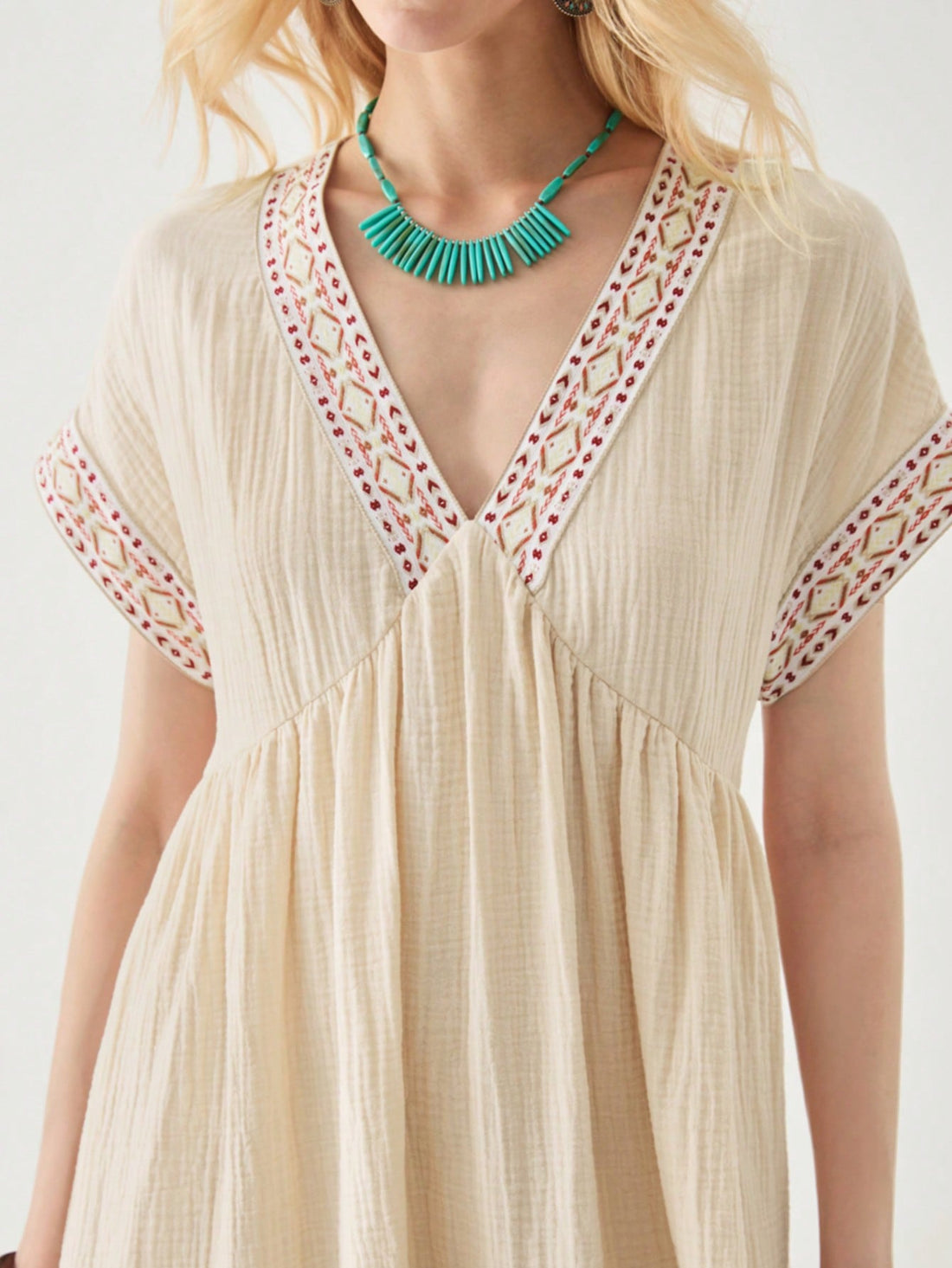 Embrace your free spirit in this playful V-neck midi dress! Delicate embroidery adds a touch of bohemian charm, while the casual silhouette keeps you comfortable from beach strolls to sunset dinners. Pack this versatile vacation essential and let your carefree style shine wherever your adventures take you!