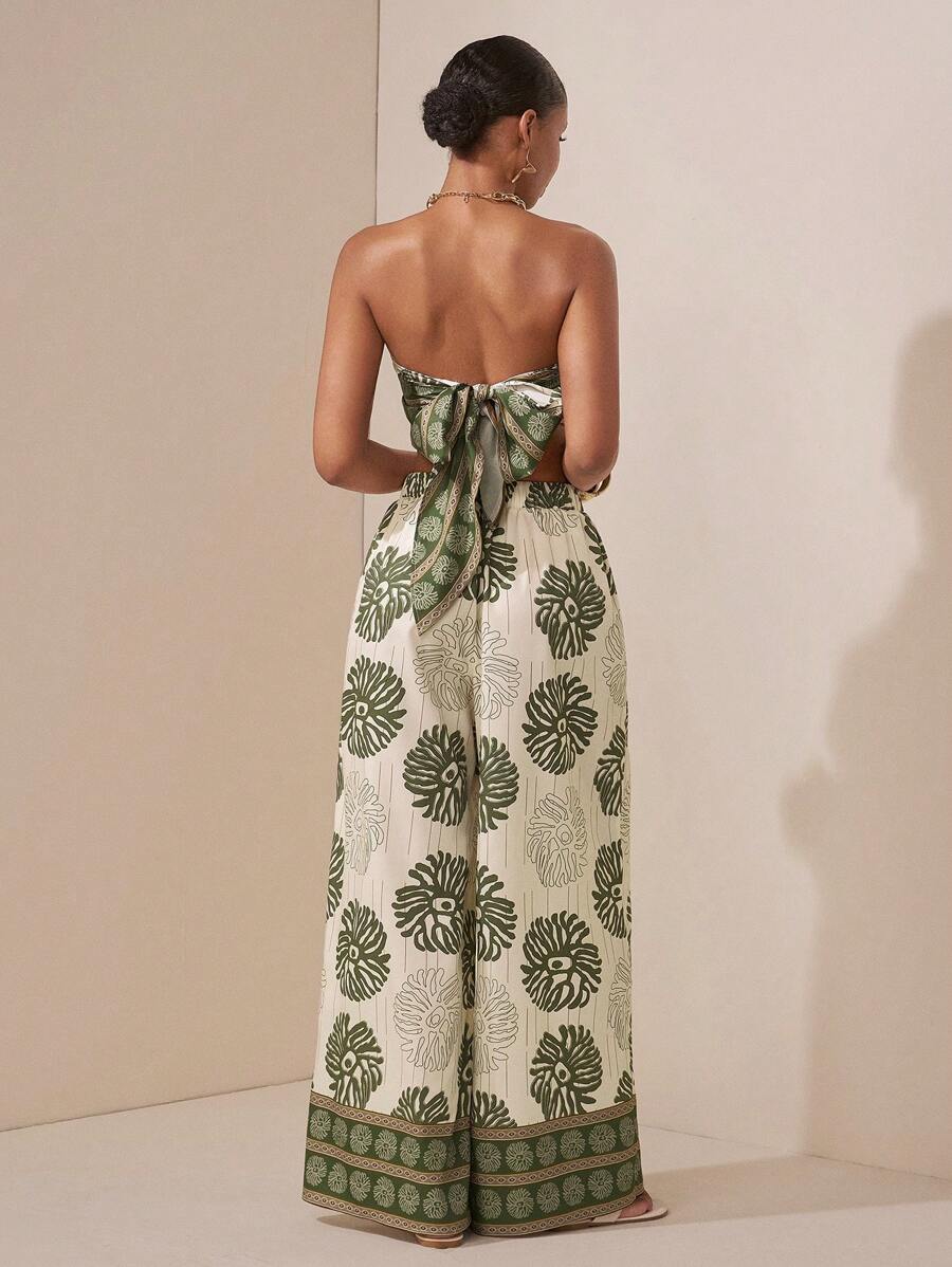 Turn heads at your next summer event in this charming two-piece set that effortlessly blends style and comfort. The elegant floral print top pairs perfectly with sleek straight-leg pants featuring practical pockets—because looking fabulous shouldn't mean sacrificing functionality. Whether you're dancing at a festival, celebrating at a wedding, or grabbing coffee with friends, this versatile ensemble keeps you feeling confident and chic. Dress it up with heels or down with sneakers for endless outfit possibi