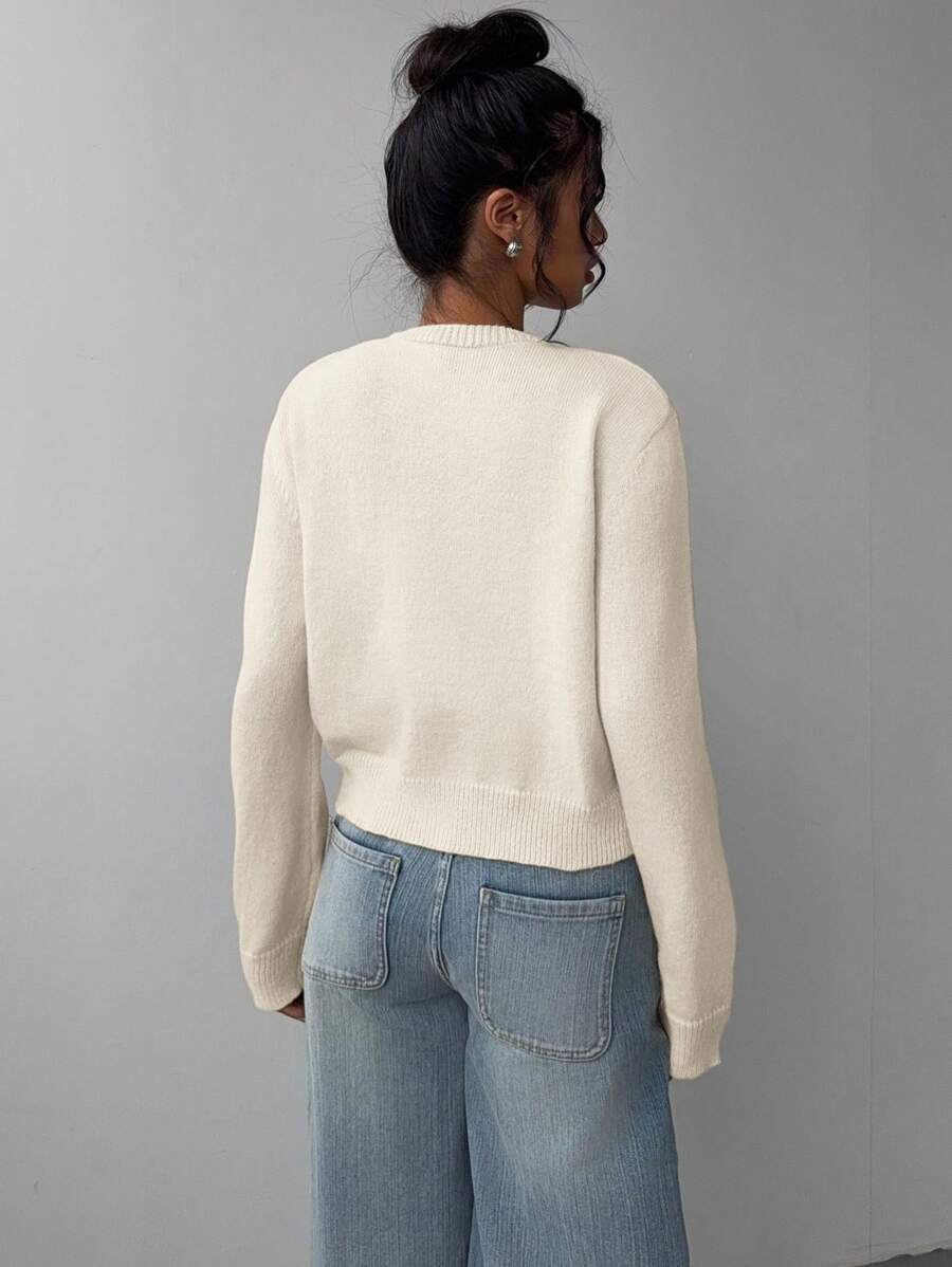 Refresh your everyday wardrobe with this Women's Cropped Knit Sweater, designed with a classic round neckline and long sleeves for a timeless, easy-to-style look. The cropped silhouette adds a modern touch while the soft knit fabric provides lightweight warmth and all-day comfort. Perfect for layering or wearing on its own, this versatile pullover pairs effortlessly with high-waisted jeans, skirts, leggings, or trousers for casual outings, work, school, or weekend adventures.