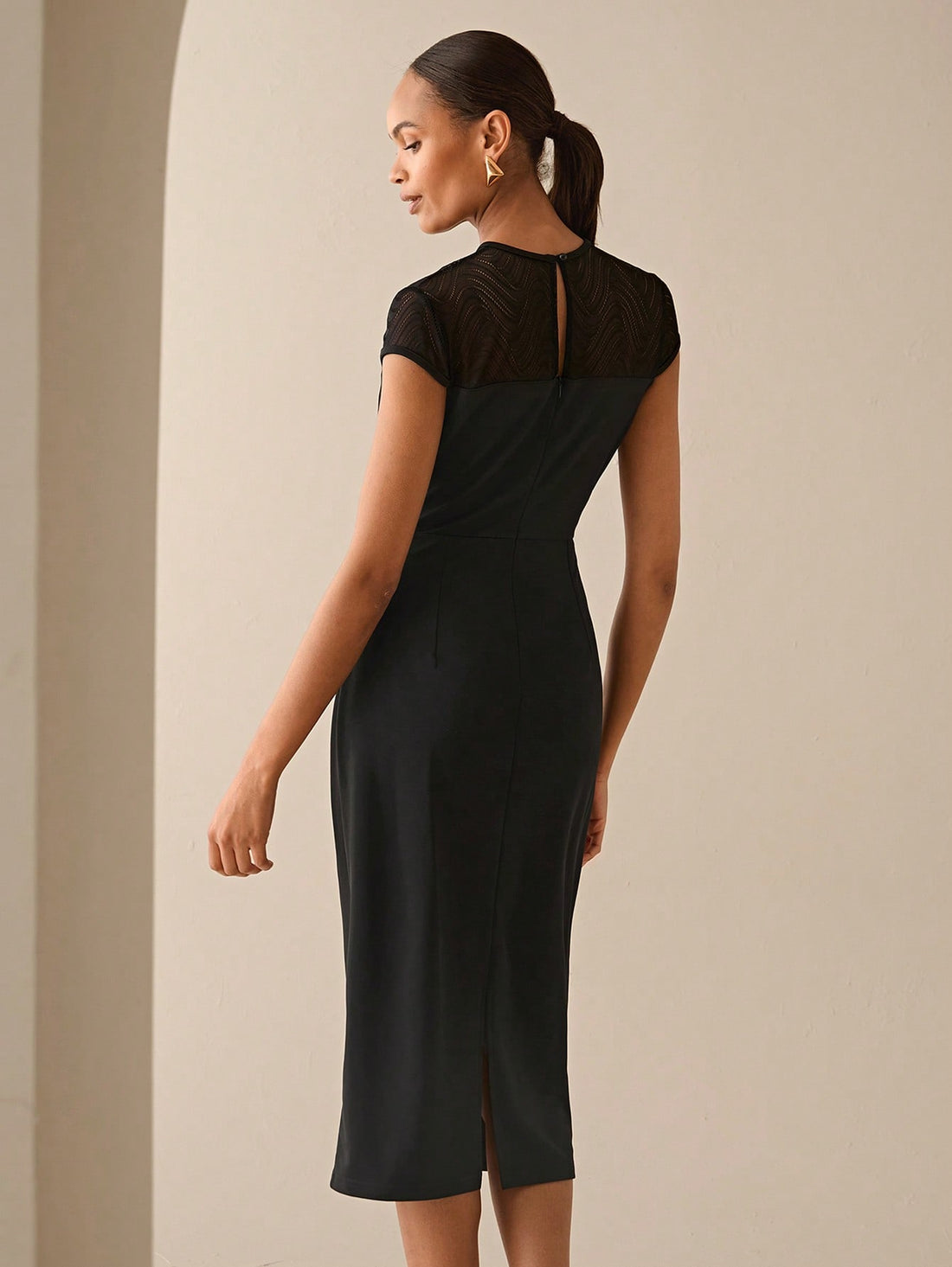 Step into the spotlight with this elegant black mid-length dress featuring a delicate lace panel. Its flattering cut and charming details make it your go-to choice for casual parties and holiday gatherings. Feel confident and effortlessly stylish while turning heads wherever you go!
