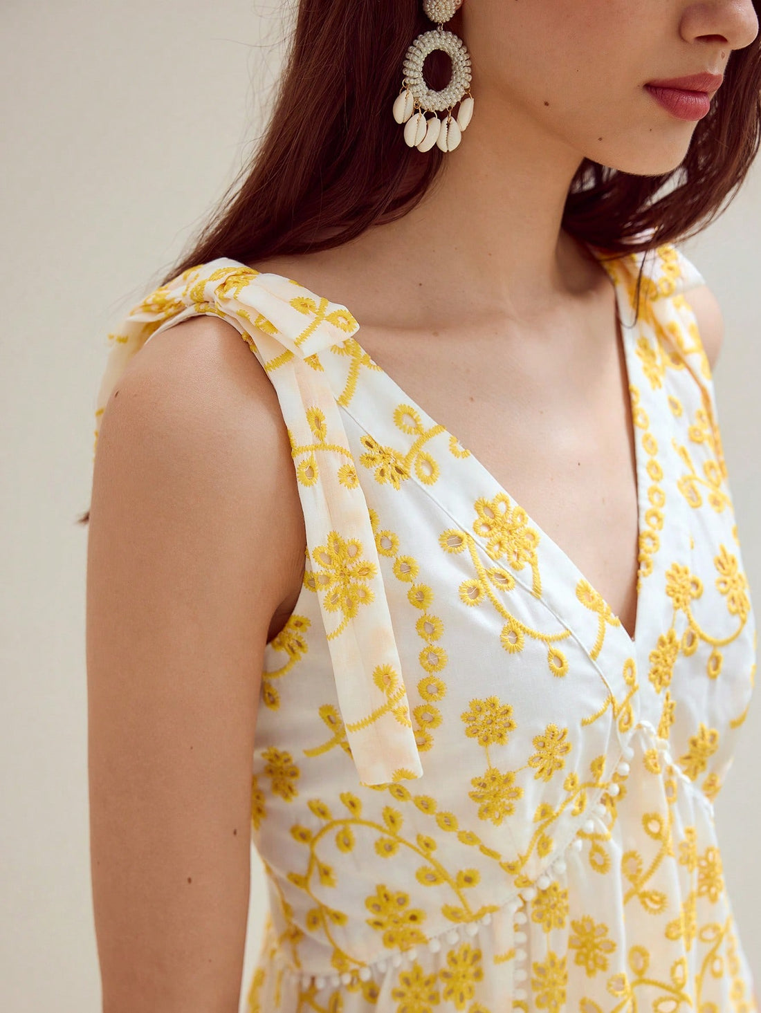 Step out in style with this Eyelet Embroidery Bow Decor Dress, designed to add a playful touch to your wardrobe. Featuring delicate eyelet embroidery and a charming bow detail, this dress blends elegance with a fun, flirty vibe. Perfect for sunny days or casual outings, it’s a delightful way to showcase your unique fashion sense while staying comfortable and chic.