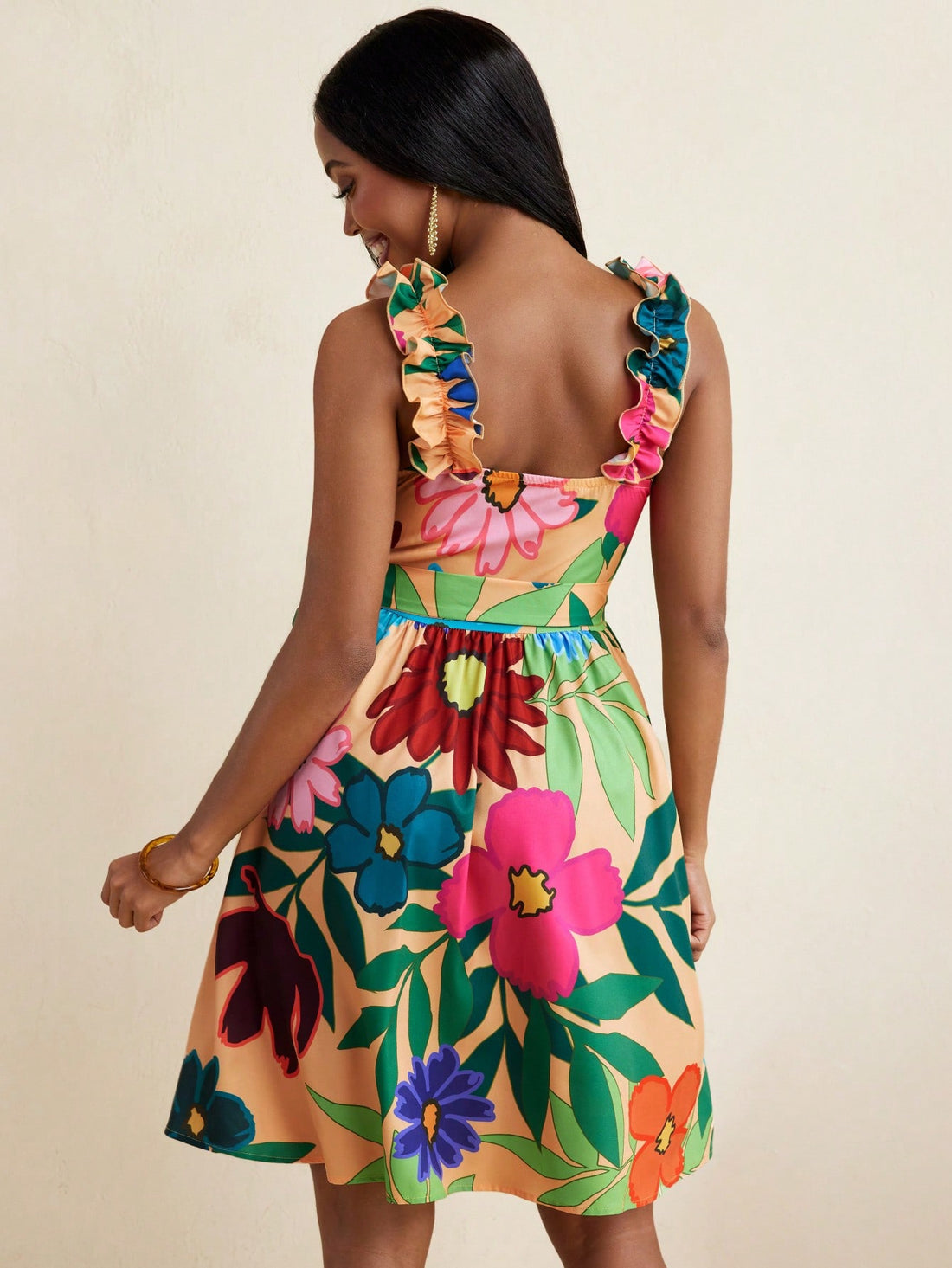 Step into summer fun with this Floral Print Ruffled Strap Mini Dress. Its playful ruffled straps and vibrant floral pattern make it the perfect beachwear for sunny days. Lightweight and breezy, it keeps you cool while adding a flirty touch to your look. Ideal for beach strolls or casual outings, this mini dress brings effortless charm to your warm-weather wardrobe.