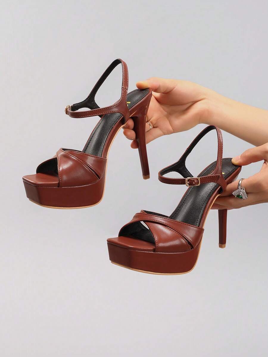 Brown crisscross platform sandal view 1 with open toe and ankle strap