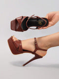 Black strappy stiletto platform sandal view 5 with open toe and ankle strap
