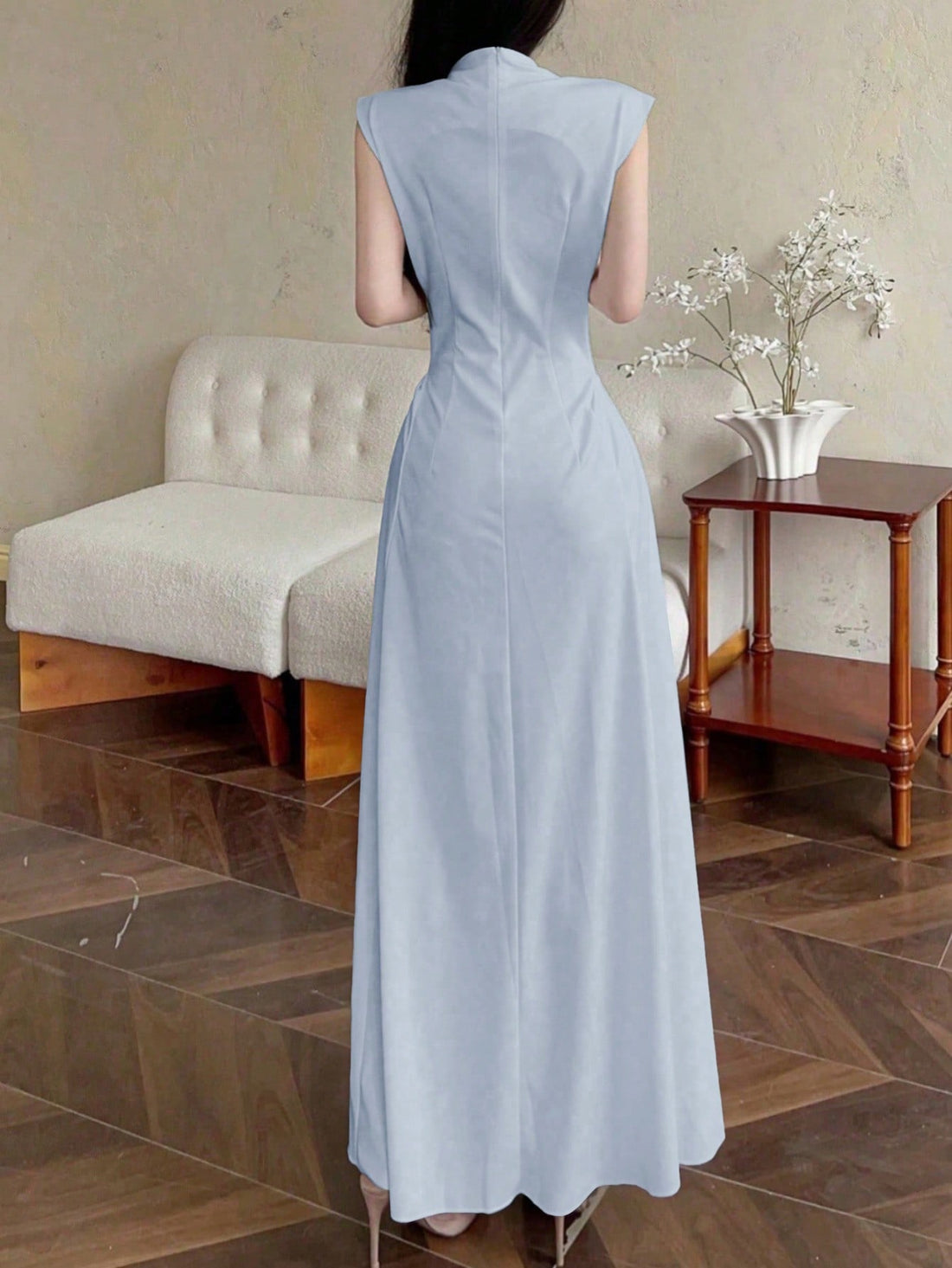 Make a statement at your next formal event with this head-turning asymmetric flared gown! The high collar adds a touch of sophistication, while the sleeveless design keeps you cool on the dance floor. This dress doesn't just fit—it flatters, with a playful asymmetric cut that swishes and sways with your every move. Who said formal had to be boring?