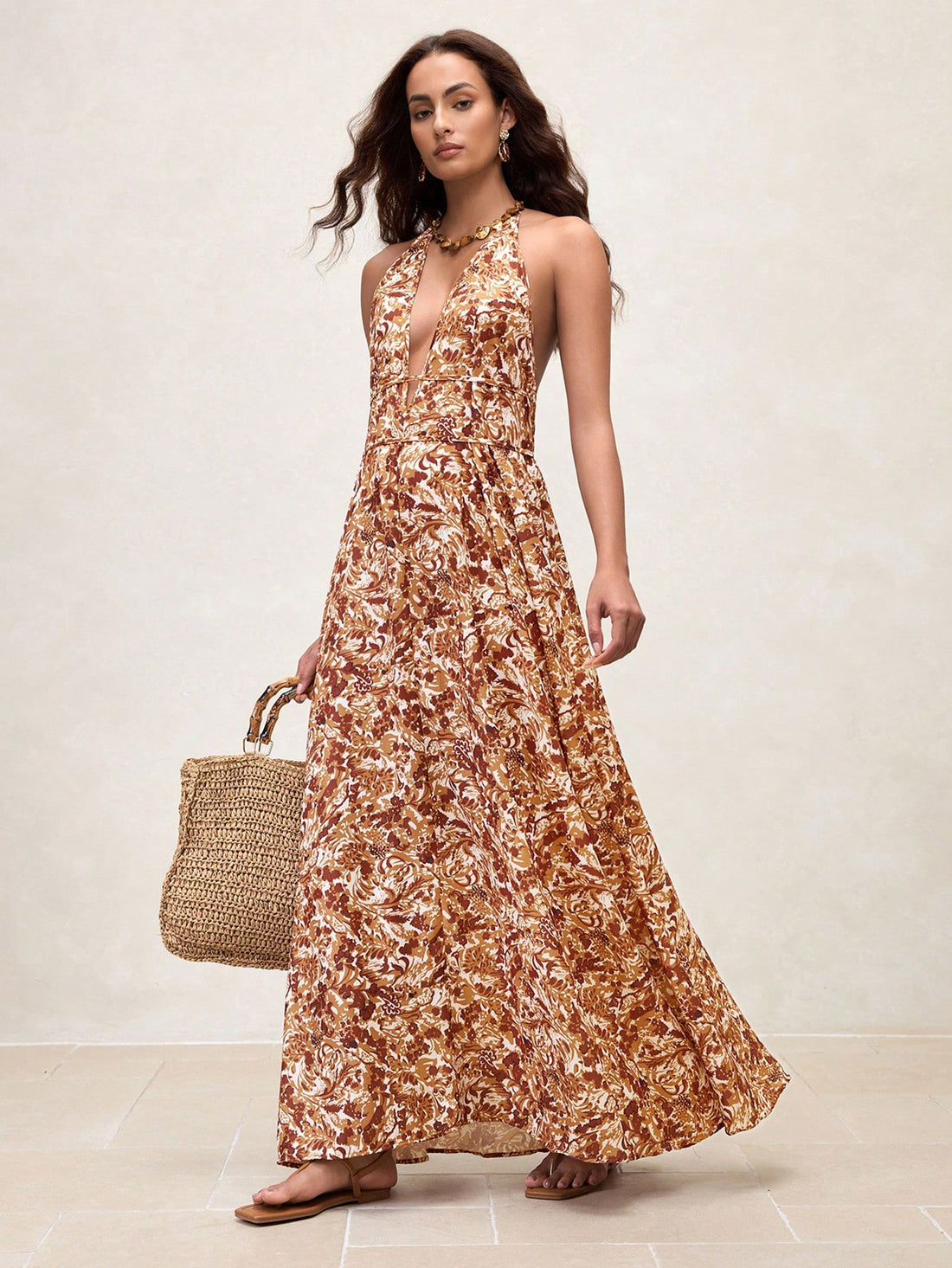 Step into sunshine and style with this Elegant Women's Floral Halter Neck Maxi Dress. Its breezy design and vibrant floral pattern make it your go-to for summer vacations and beach days. The halter neck adds a flirty touch while keeping you cool and comfortable. Perfect for twirling on sandy shores or strolling through seaside towns, this dress brings effortless charm to your warm-weather wardrobe.