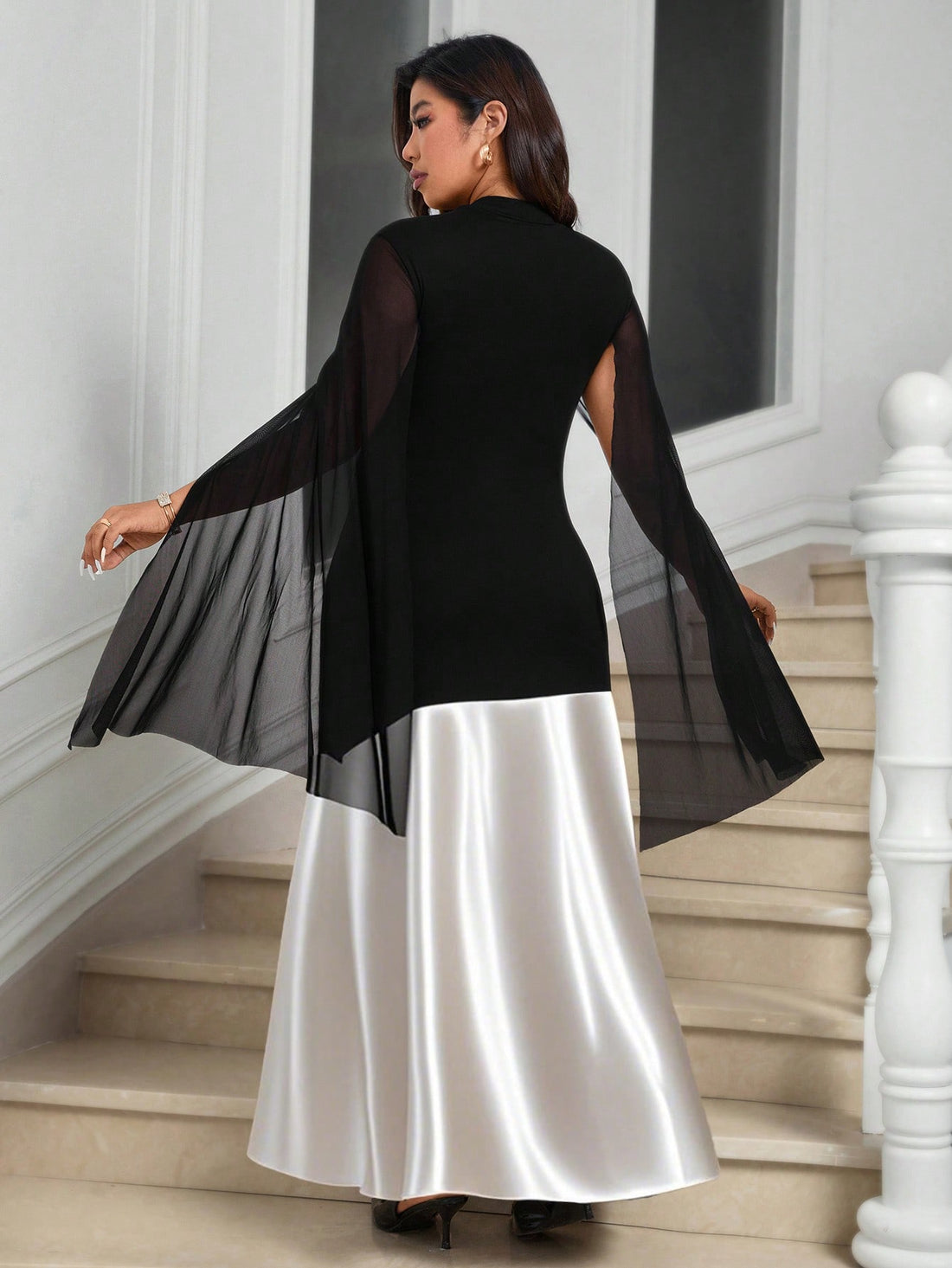 Turn heads with this Plus Size Women's Elegant Tight Fit Satin and Sheer Mesh High-Neck Split Poncho Dress. It hugs your curves in all the right places with its sleek satin finish, while the sheer mesh and high-neck design add a flirty, mysterious vibe. The daring split allows a playful glimpse of your legs, making it perfect for nights when you want to sparkle and sizzle. Dress up your confidence and own every room you enter!
