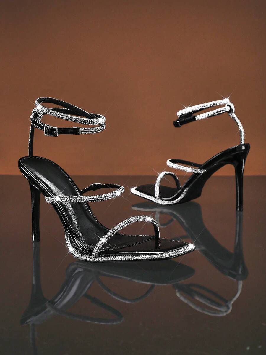 Step into sophistication with these glamorous metallic snakeskin ankle strap sandals. Featuring a striking snakeskin texture in shimmering metallic tones, these sandals deliver instant elegance to any spring or summer outfit. The secure ankle strap ensures comfort and stability, while the sleek design transitions effortlessly from daytime outings to evening occasions. Perfect for elevating casual looks or complementing dressier ensembles
