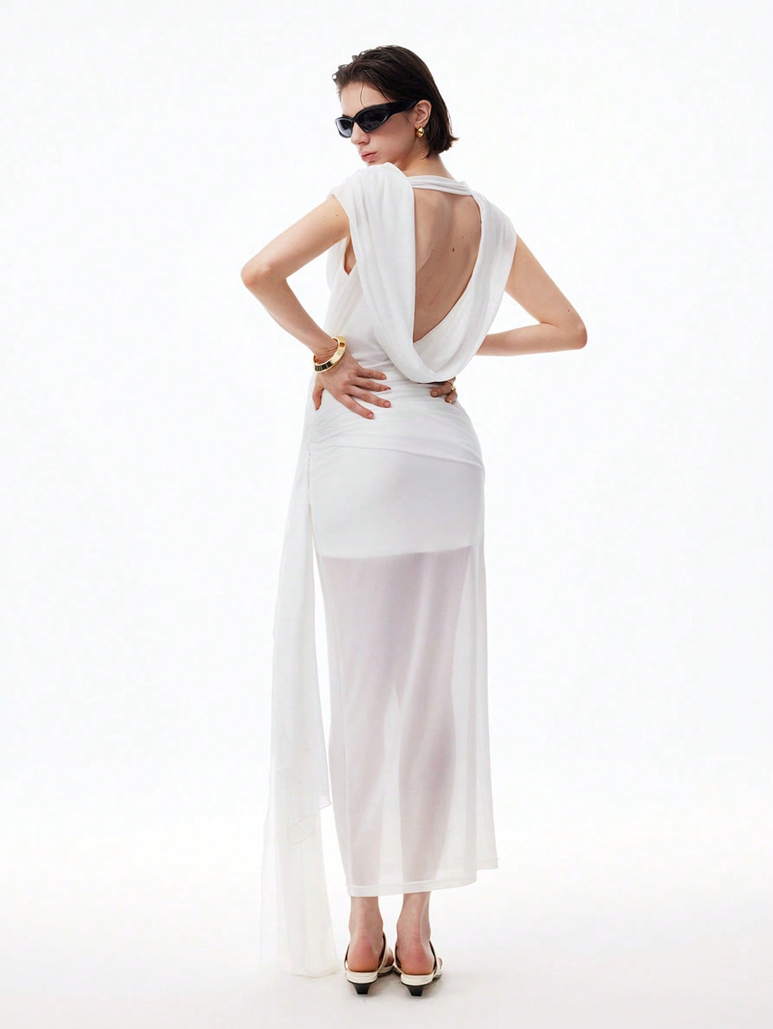 Step into summer with this playful sleeveless tulle mini dress, featuring charming ruched details and a flirty asymmetric hem. Perfect for date nights or graduation celebrations, it combines light, airy fabric with a fun silhouette to keep you comfortable and stylish all evening long. Embrace effortless elegance and turn heads wherever you go!