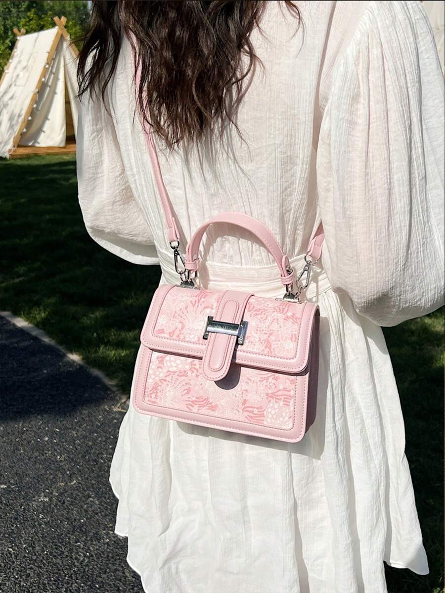 Ivory floral handbag with detachable shoulder strap
