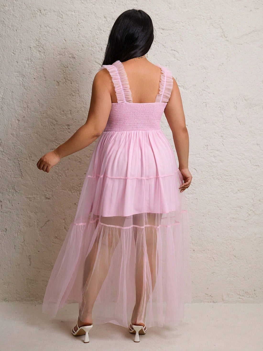 Step into the spotlight with this playful plus size pink maxi dress! Featuring sleeveless layers of soft chiffon and flattering ruching, it effortlessly combines comfort and style. Perfect for twirling at parties or making a statement at special occasions, this dress celebrates your curves with elegance and fun flair.