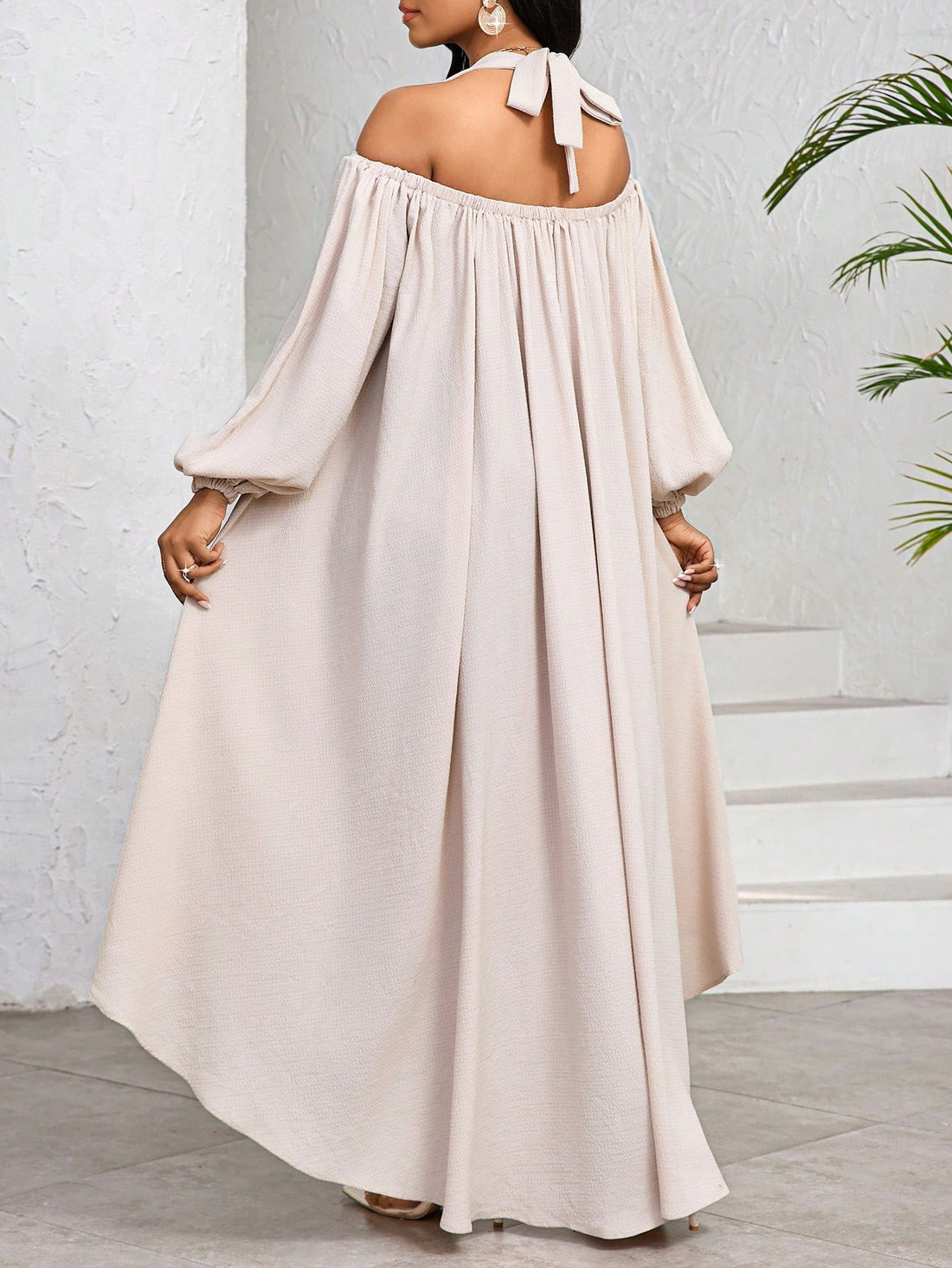 This floral print dress with open shoulders and lantern sleeves is the perfect choice for your summer vacation wardrobe. Show off your playful side with its unique design, while staying cool and stylish all day long. A must-have for every woman's summer wardrobe.