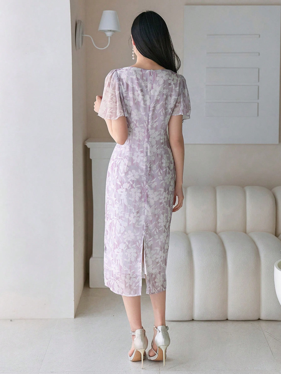 Twirl into summer with our Ditsy Floral Midi Dress! Those adorable ruffle sleeves add just the right amount of flirty fun, while the midi length keeps things classy. Perfect for garden parties, brunch dates, or whenever you want to feel like the sunshine goddess you are! The delicate floral pattern practically dances with every step.