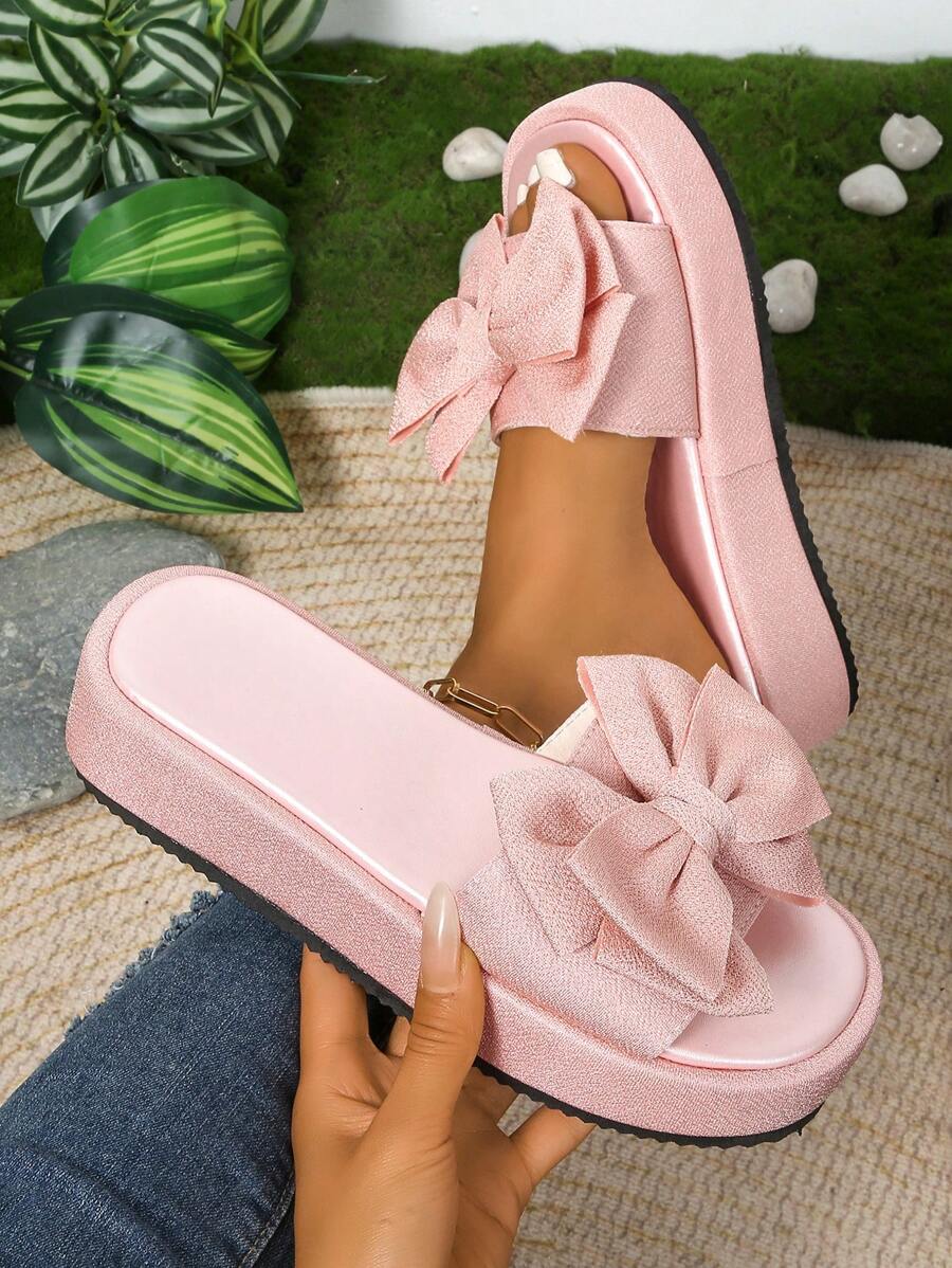 Step up your style game with these Elegant Bowknot Thick Platform Slip-On Sandals! Perfectly playful in rose red and black, they feature a chic bowknot detail and a waterproof design that keeps your feet comfy and dry. The thick platform adds height without the hassle, making every step feel like a breeze. Slip them on and strut your stuff wherever the day takes you!