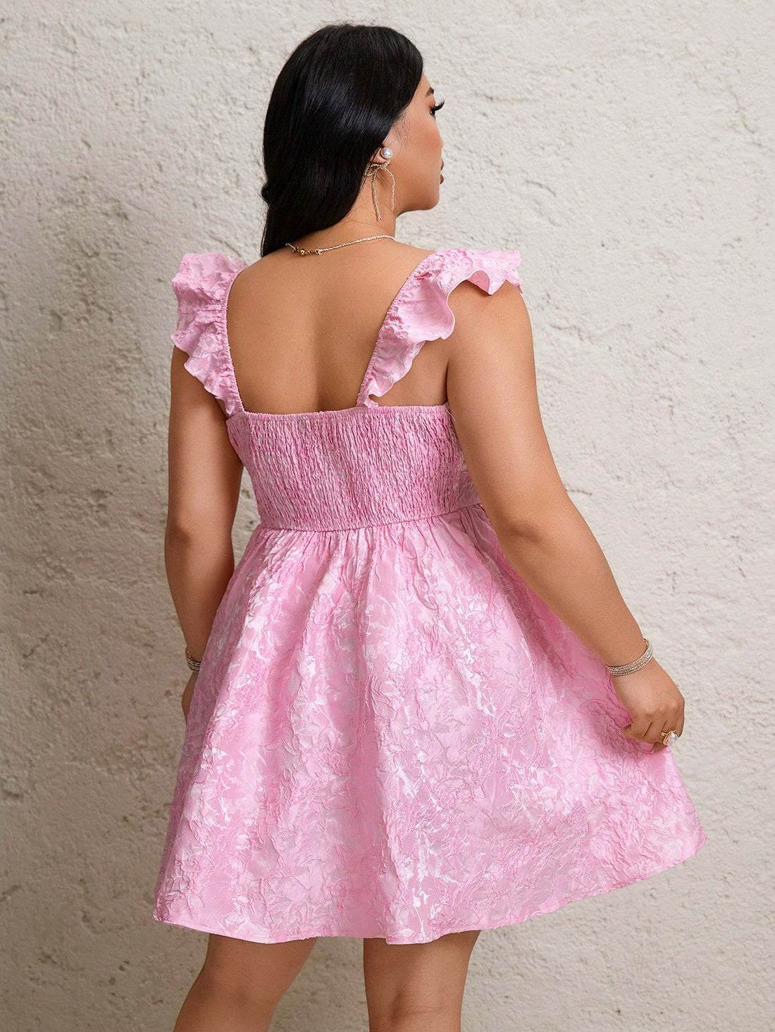 Step into spring with this playful plus size pink jacquard dress, featuring textured fabric and charming flare sleeves. Its elegant design makes it a perfect pick for festivals and weddings, combining comfort with a touch of whimsy to brighten your special occasions.