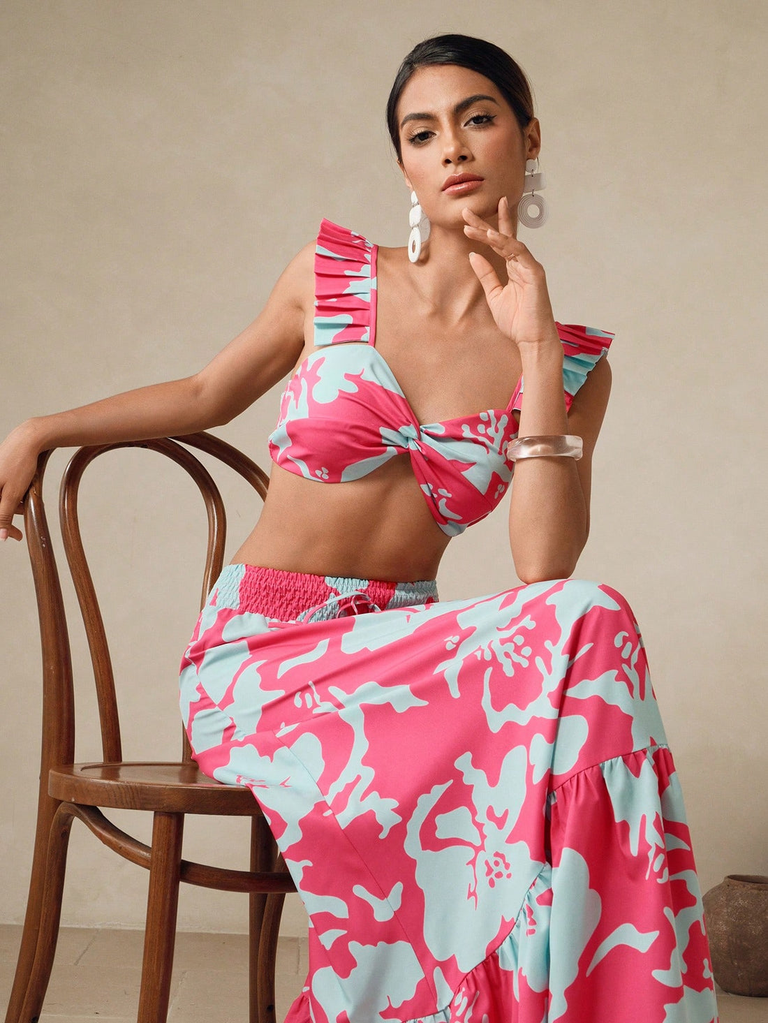 Make a splash with confidence in this charming two-piece swim set! Featuring a vibrant floral print that brings tropical vibes to poolside style, this set pairs a flattering crop top with a playful ruffle-hem skirt for a fun, feminine look. The coordinated design creates an effortlessly put-together appearance, while the skirt's ruffled detail adds movement and flair. Perfect for beach days, pool parties, or vacation getaways, this set lets you express your style while enjoying the water. Mix, match, and ha