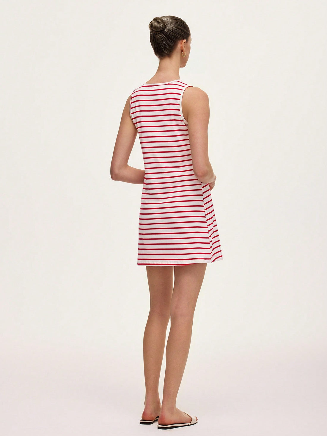 Step out in style with this chic women's striped sleeveless dress, blending vintage charm with casual comfort. Its playful stripes and breezy design make it perfect for effortless, all-day wear. Whether you're headed to brunch or a sunny stroll, this dress adds a fun, timeless touch to your wardrobe.