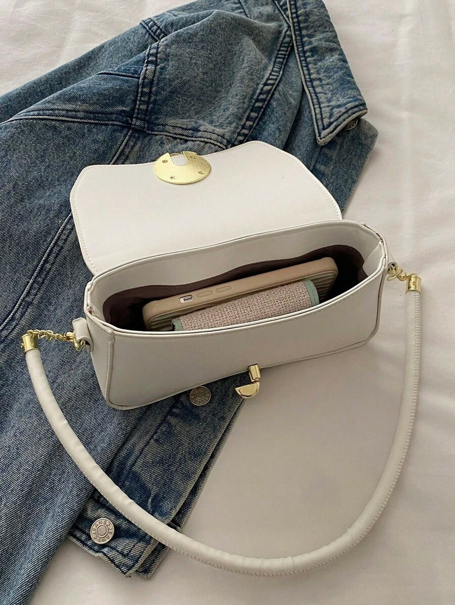 This chic minimalist chain underarm bag is your stylish sidekick for work, school, and travel adventures. Compact yet spacious enough, it keeps your essentials close with ease. The sleek design paired with a trendy chain strap adds a playful edge to any outfit. Carry confidence wherever you go!