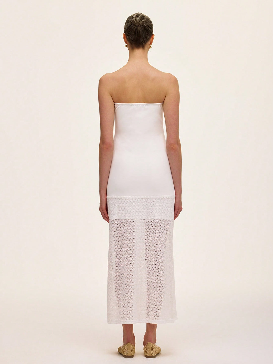 Step out in style with this elegant strapless dress featuring a solid color design and a delicate lace hollow hem. Perfect for turning heads at any event, its playful yet sophisticated look lets you dance the night away with confidence and charm.