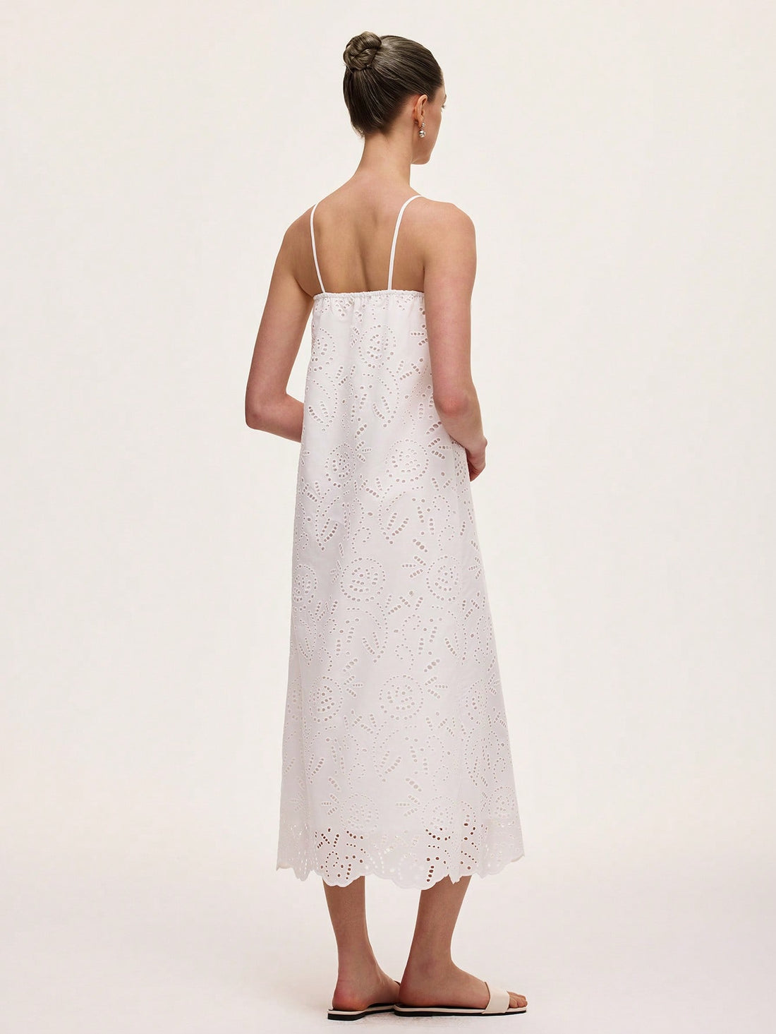 Step into sunshine with this playful green vintage-inspired dress! Featuring delicate hollow embroidery and slender spaghetti straps, it’s perfect for carefree vacation days. The sleeveless design keeps you cool while adding a flirty touch, making it your go-to for warm-weather adventures. Embrace effortless elegance and let your style bloom wherever you wander.