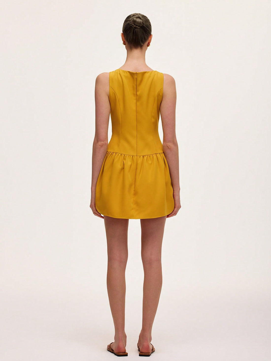 Step out in style with this chic sleeveless midi dress featuring a charming French ruffle hem. Its playful silhouette offers effortless elegance, perfect for twirling through sunny afternoons or dazzling at evening soirees. Light, breezy, and fabulously flirty—this dress is your new go-to for turning heads with ease.