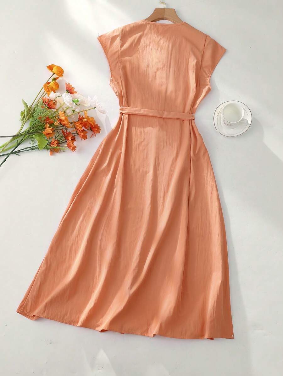 This minimalist round neck dress brings effortless chic to your wardrobe! The flattering tie waist cinches in all the right places, while the solid color design makes styling a breeze. Dress it up with heels or down with sneakers – this versatile piece is ready for whatever fun the day brings. Your new go-to for those "nothing to wear" moments!