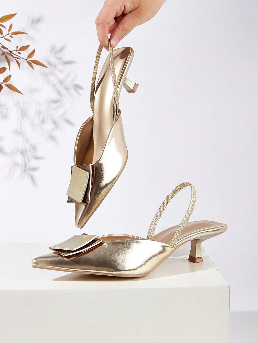 Step into sophistication with these stunning slingback heels featuring a sleek pointed toe and eye-catching metallic buckle detail. Perfect for elevating your party look, these heels deliver that perfect blend of glamour and comfort. The secure slingback design keeps you steady all night while the metallic accent adds just the right amount of sparkle. Whether you're hitting the dance floor or making a grand entrance, these heels are your ticket to turning heads and feeling absolutely fabulous.