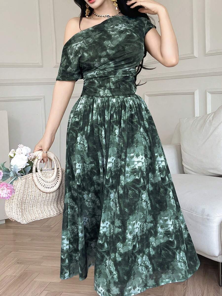 Make a statement this season with our vibrant tie dye 2-piece set! The asymmetric neckline top pairs perfectly with the coordinating skirt for an effortlessly chic look that turns heads. Soft, breathable fabric keeps you cool and comfortable all day long, while the bold tie dye pattern adds that perfect pop of personality. Whether you're hitting the beach, catching up with friends, or just living your best summer life, this set delivers style that's totally you. Mix, match, or wear together—the possibilitie