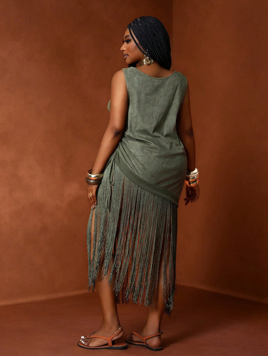 Embrace sunny days in this playful olive green suede sundress crafted just for curves. Its bohemian flair and soft suede texture make it the perfect companion for spring and summer escapes. Flowy and flattering, it keeps you comfy while turning heads wherever your adventures take you.