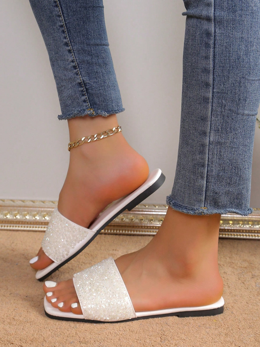 Step into sparkle with our Crystal Rhinestone Slip-On Slippers! These dazzling sandals bring the bling to your everyday strolls. Comfy enough for lounging, glam enough for brunch dates, and versatile enough to rock year-round. Why choose between style and comfort when these sassy slip-ons deliver both? Your feet deserve this little party!