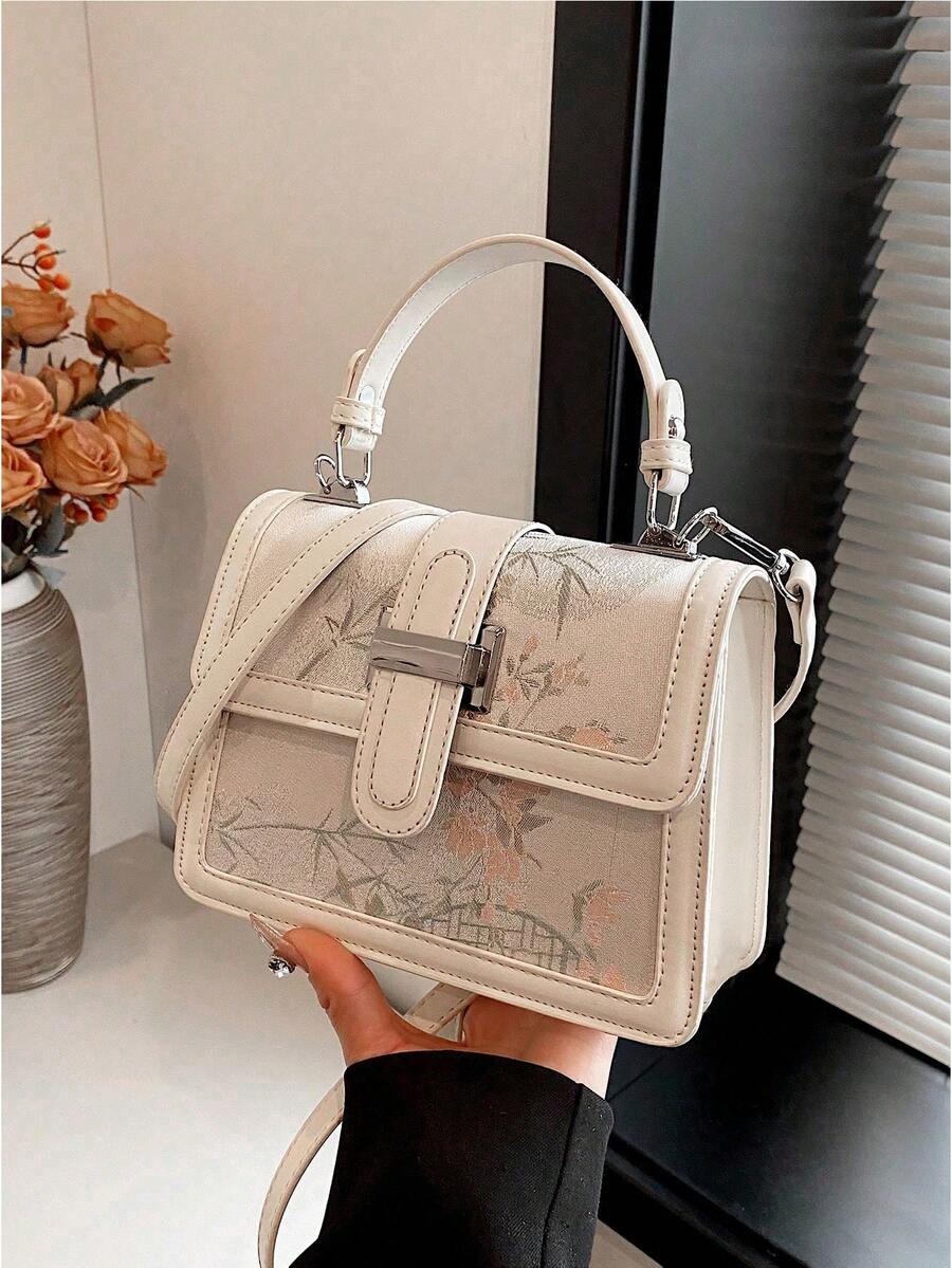 Ivory floral handheld bag with silver-tone hardware