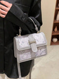 Gray floral handbag with short top handle