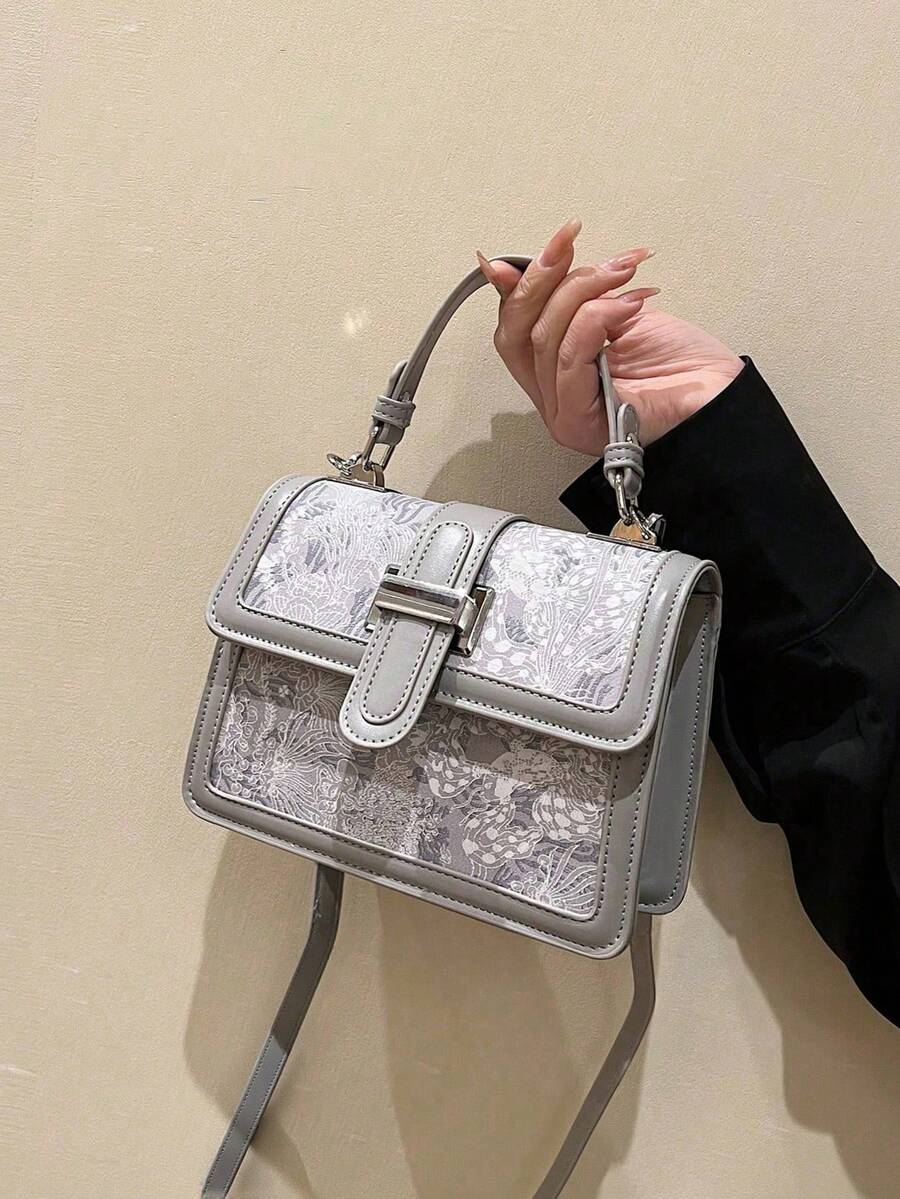 Ivory printed handbag with flap closure