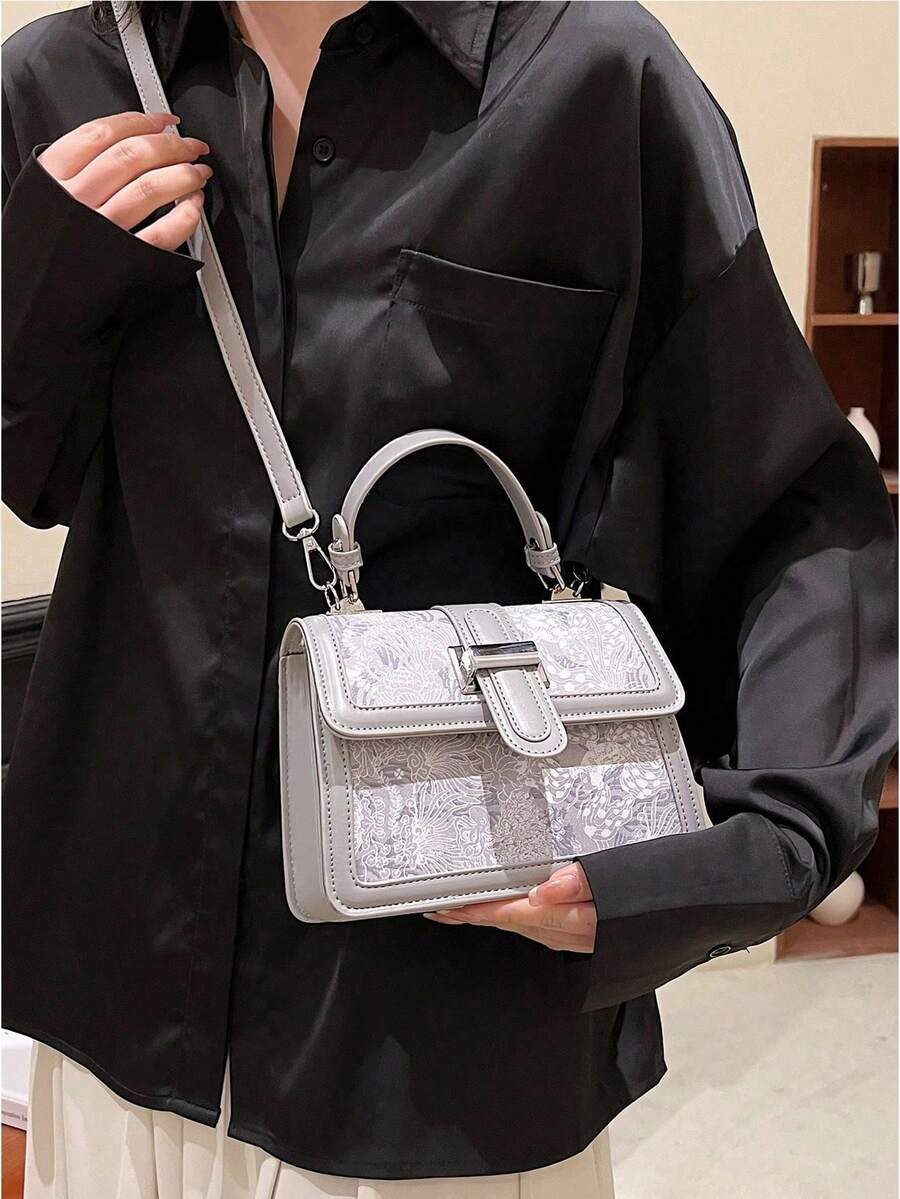 Black floral shoulder bag with turn lock
