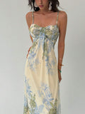 Close up of floral maxi dress bodice with gathered bust center knot and botanical print