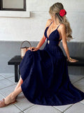 Navy blue spaghetti strap cutout tiered maxi dress, seated front view