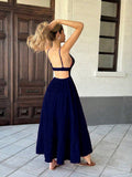 Navy blue open-back tiered maxi dress, rear view
