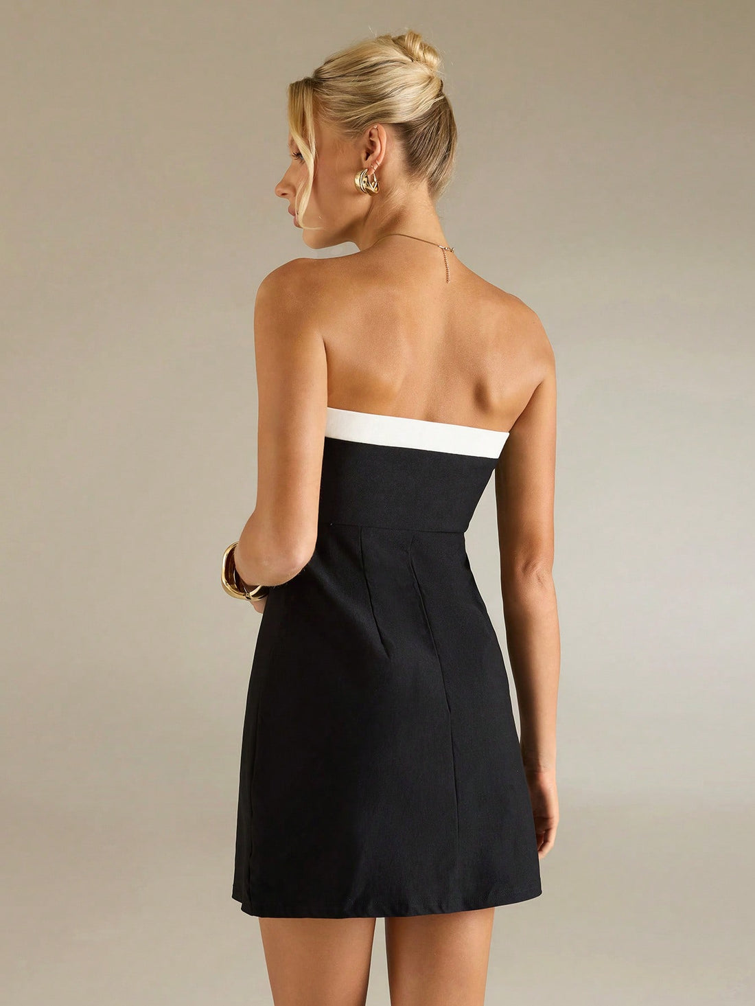 Step into the spotlight with this playful 90s-inspired strapless mini dress, designed to brighten your spring and summer days. Its chic silhouette is perfect for prom nights, lively parties, or casual outings where you want to turn heads. Lightweight and flirty, this dress combines nostalgic charm with modern fun, making every moment feel like a celebration.