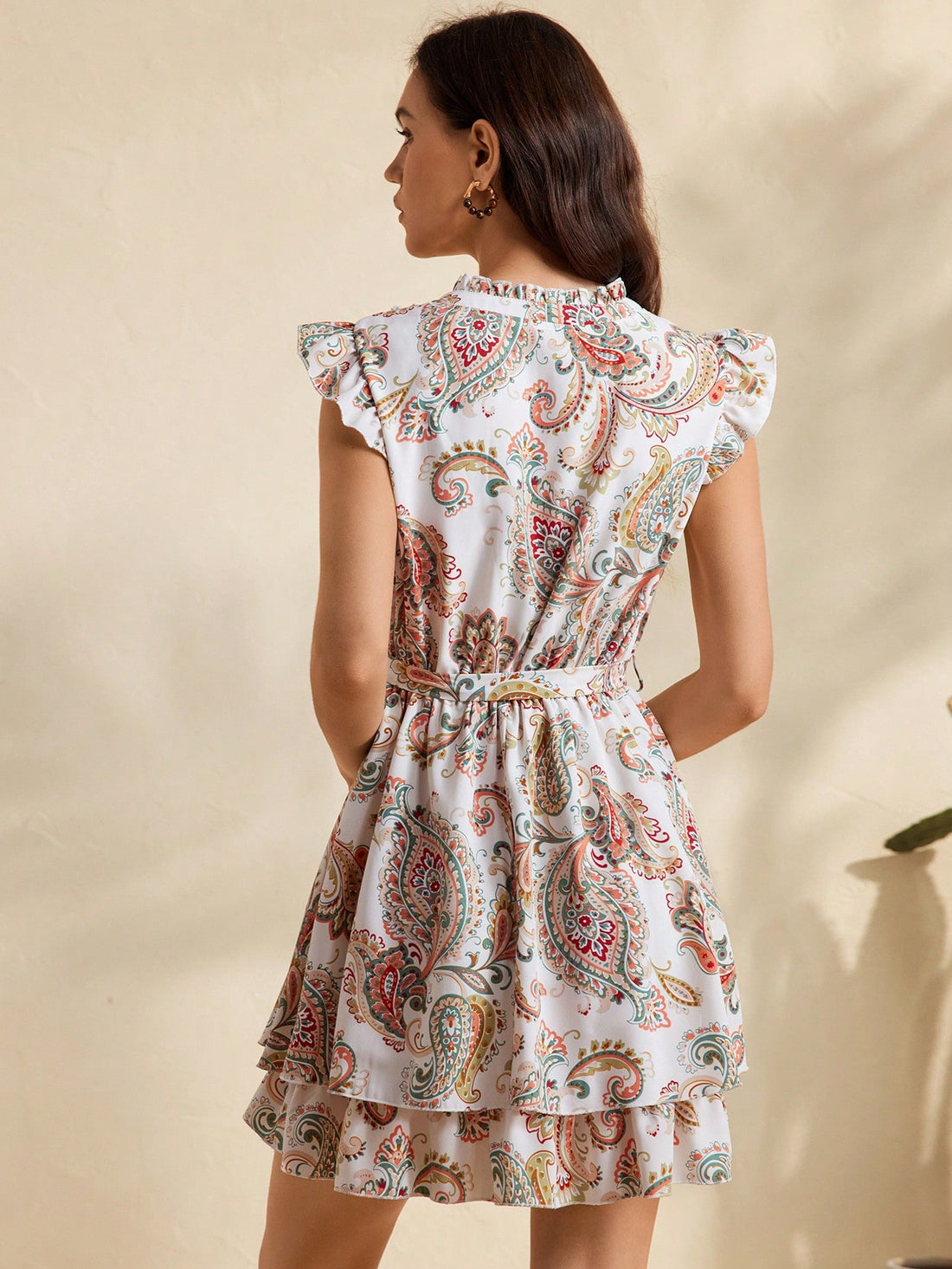 Embrace your free spirit in this whimsical bohemian dress! With playful cap sleeves, a flattering tie-up waist, and a flirty ruffled hem, you'll be turning heads wherever your adventures take you. The eye-catching print adds just the right amount of fun to your vacation wardrobe – because life's too short for boring clothes!