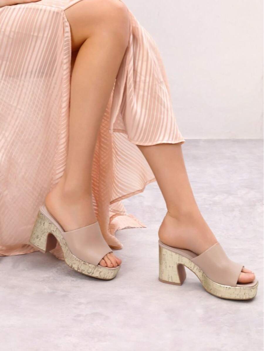 Step into summer with these playful platform chunky heel slip-on sandals designed for stylish comfort. Their bold, elevated sole adds a fun pop to any outfit while providing all-day support. Perfect for beach days or city strolls, these sandals make it easy to stay cool and look fabulous without sacrificing comfort. Ready, set, summer!