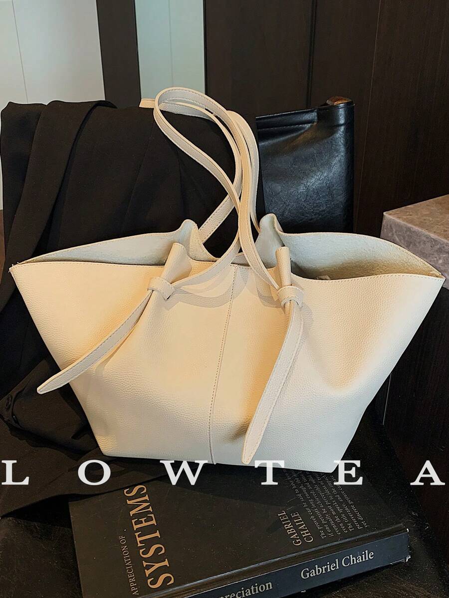 Elevate your everyday with this Stylish Low Tea PU Leather Tote Bag! Featuring a chic dual handle design, it’s your perfect companion for travel, work, or just zooming through your daily adventures. Practical yet fashionable, it holds all your essentials with ease—because your bag should work as hard as you do and look fabulous doing it!
