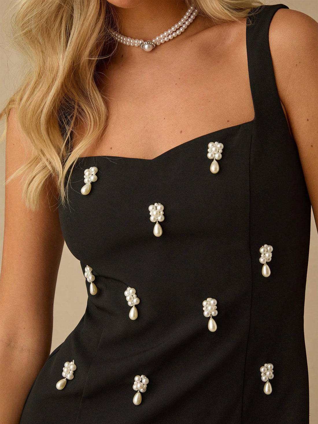 Elevate your summer style with our Elegant Black Pearl Mini Dress. Perfect for parties, dates, and special occasions, this dress features a playful twist on the classic little black dress with a touch of sparkling pearls. Stay chic and cool while turning heads.